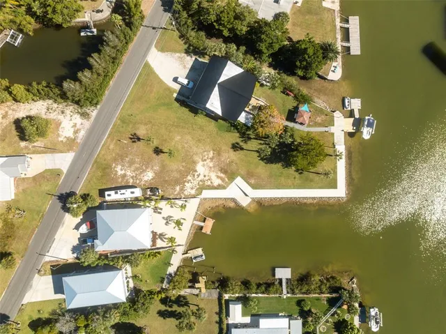 an aerial view of a house with a ocean view