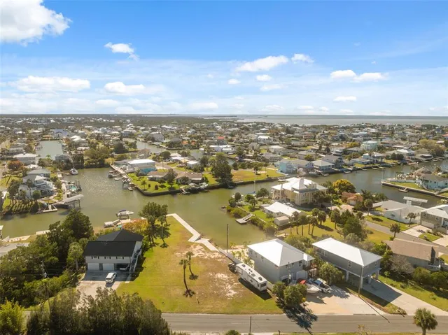 a view of a lake with a table and chairs