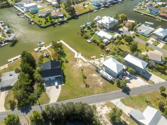 an aerial view of a house with a lake view