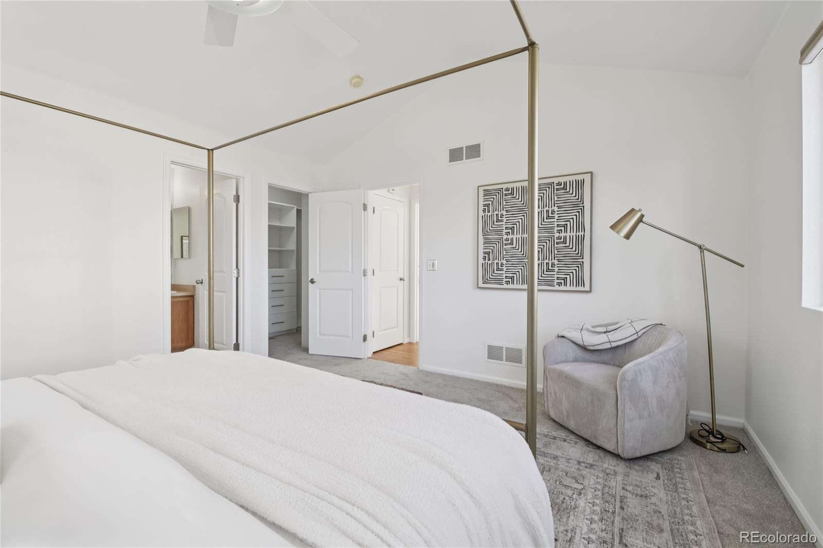 11340 Locust Street Thornton, CO 80233 - Photo 11 of 33 a bedroom with a bed and glass door