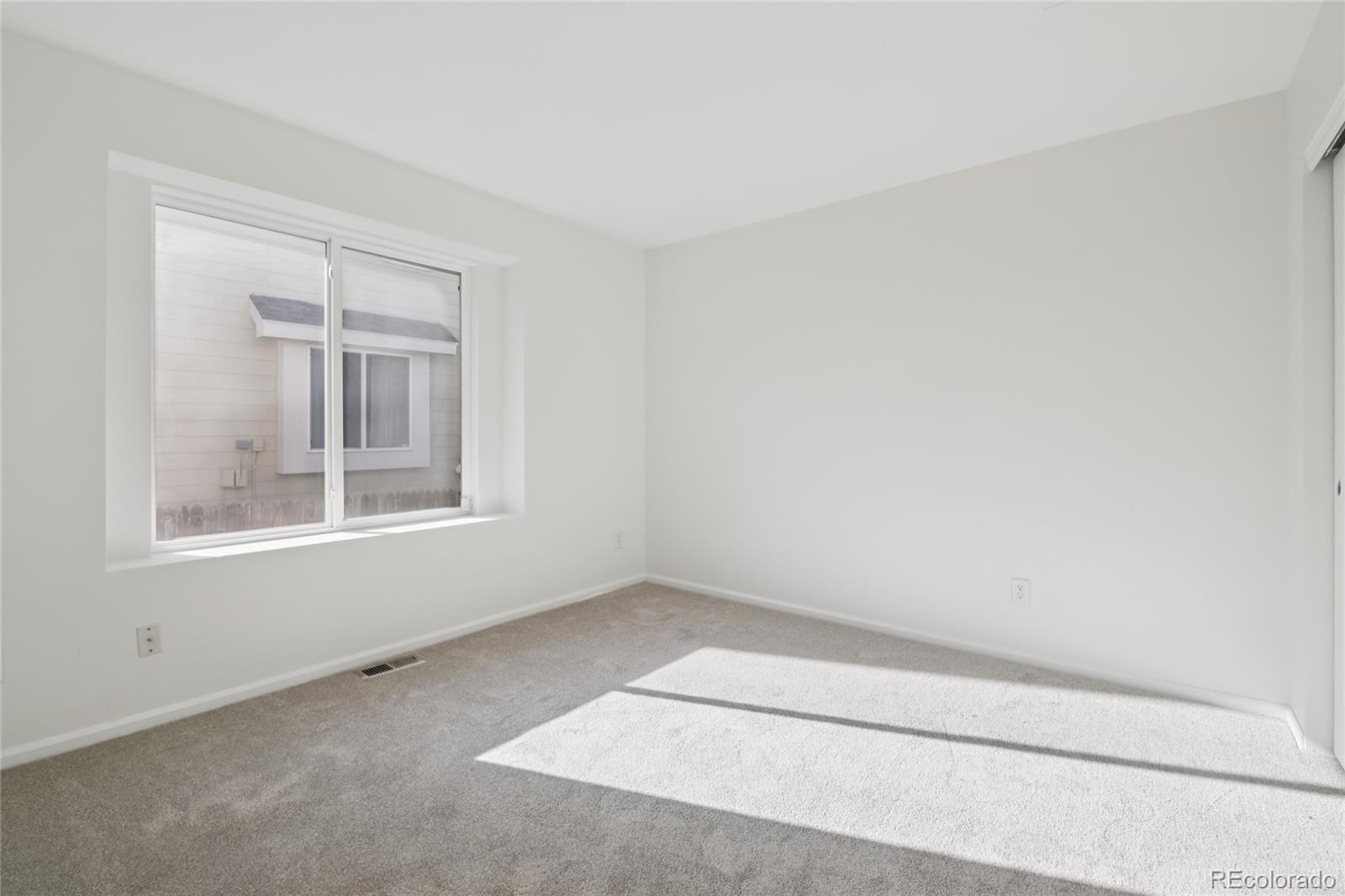 11340 Locust Street Thornton, CO 80233 - Photo 15 of 33 an empty room with a window