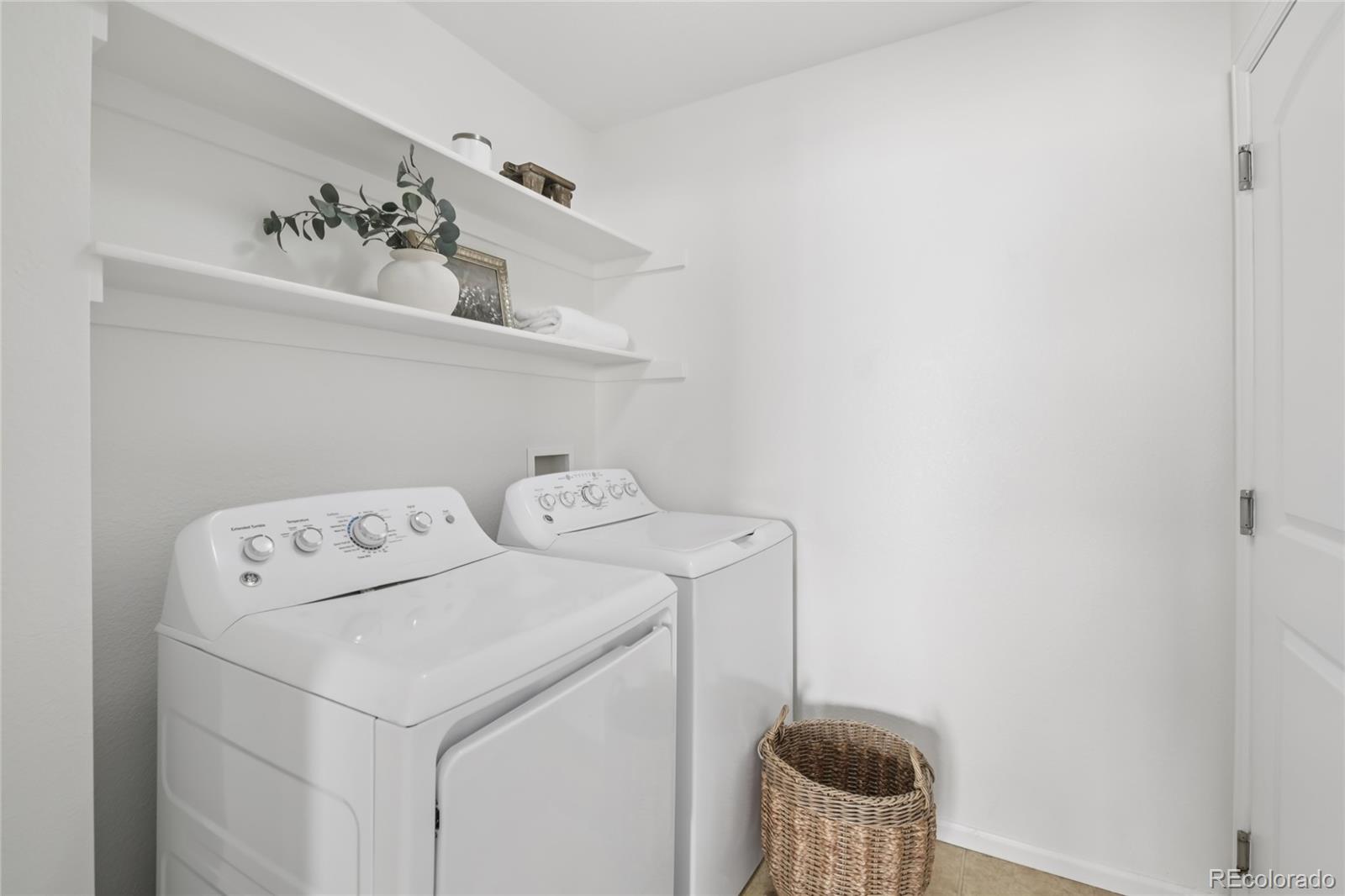 11340 Locust Street Thornton, CO 80233 - Photo 17 of 33 a utility room with dryer and washer