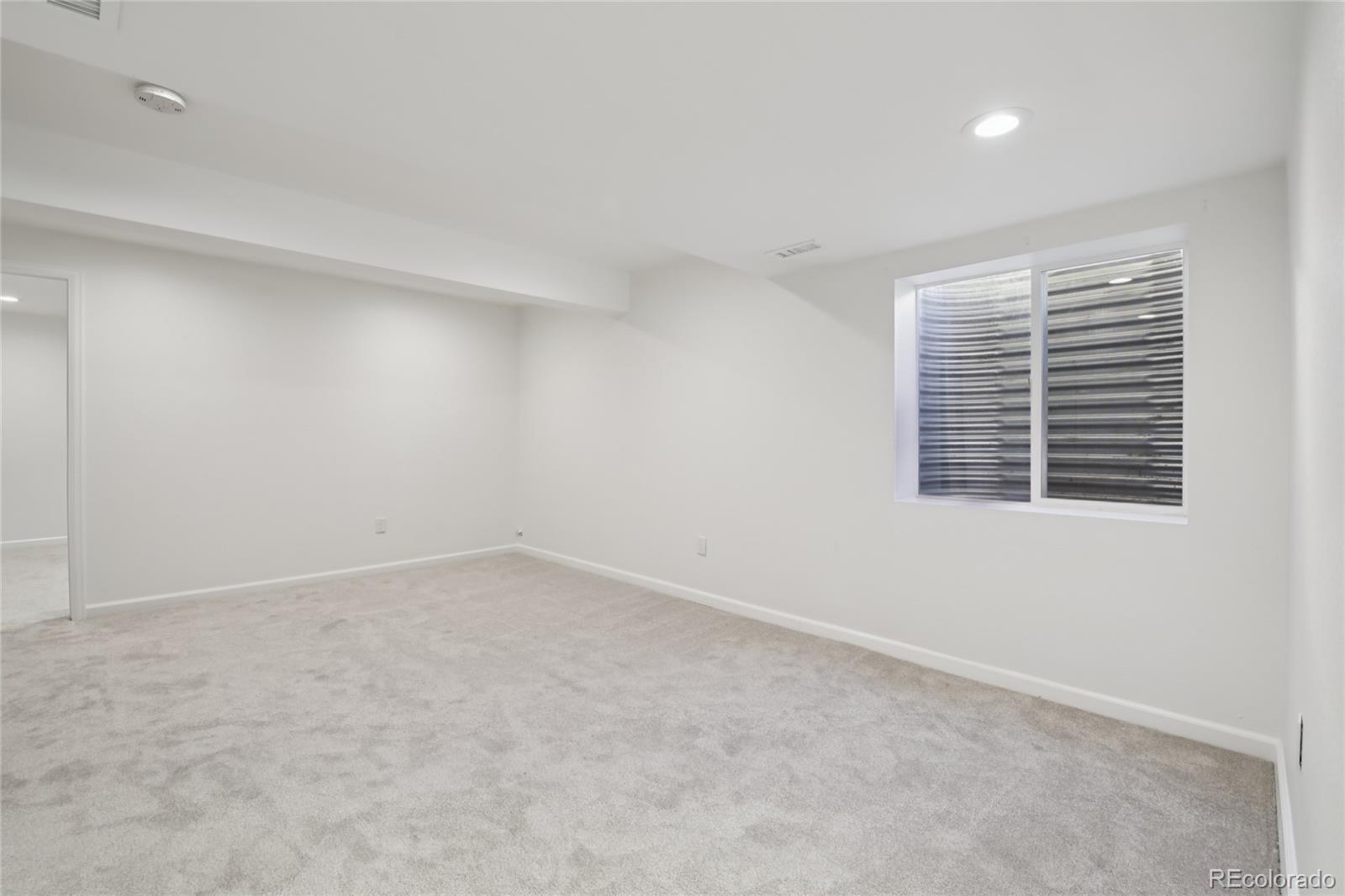 11340 Locust Street Thornton, CO 80233 - Photo 21 of 33 an empty room with windows