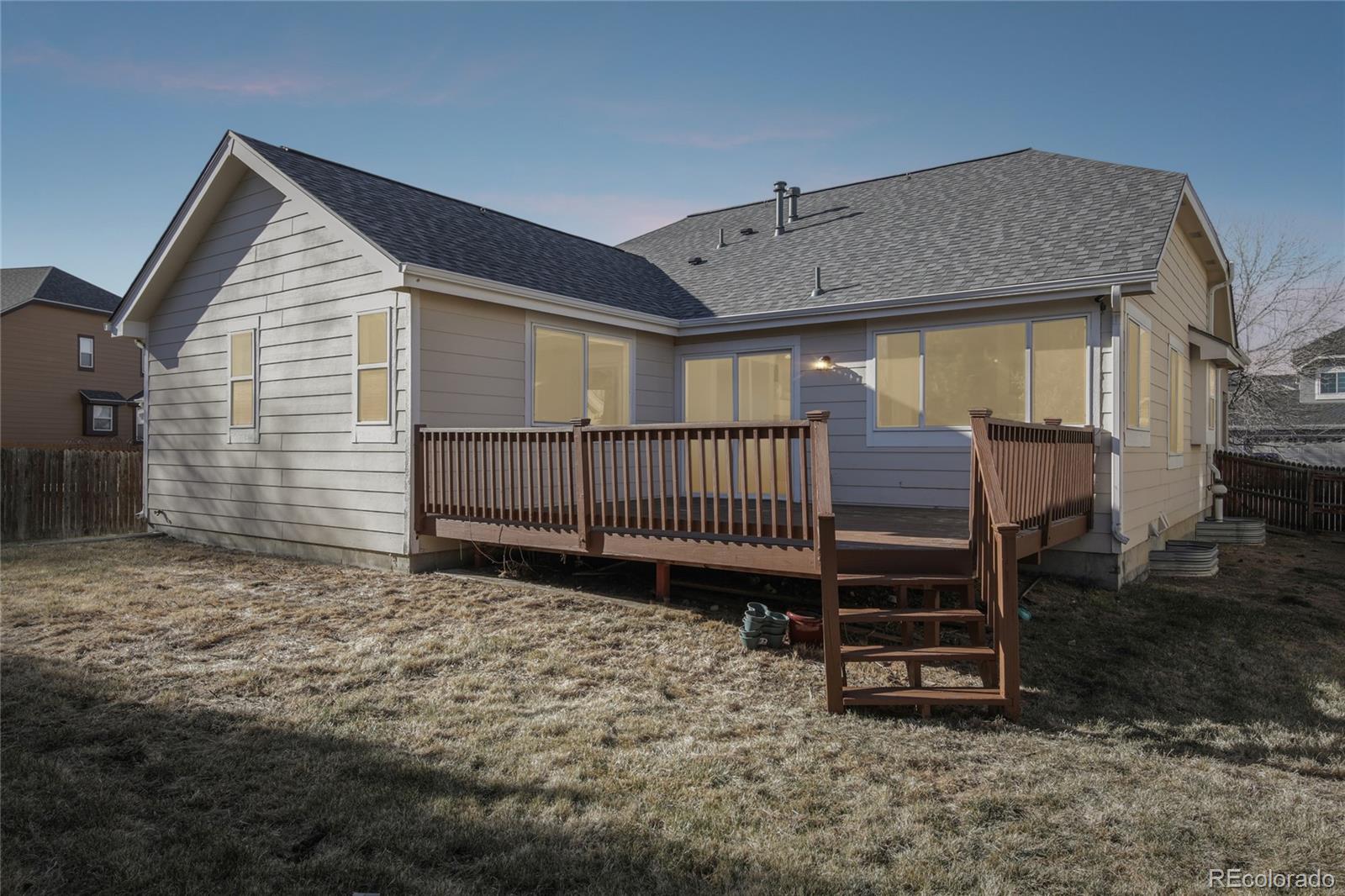 11340 Locust Street Thornton, CO 80233 - Photo 27 of 33 a view of a house with a backyard