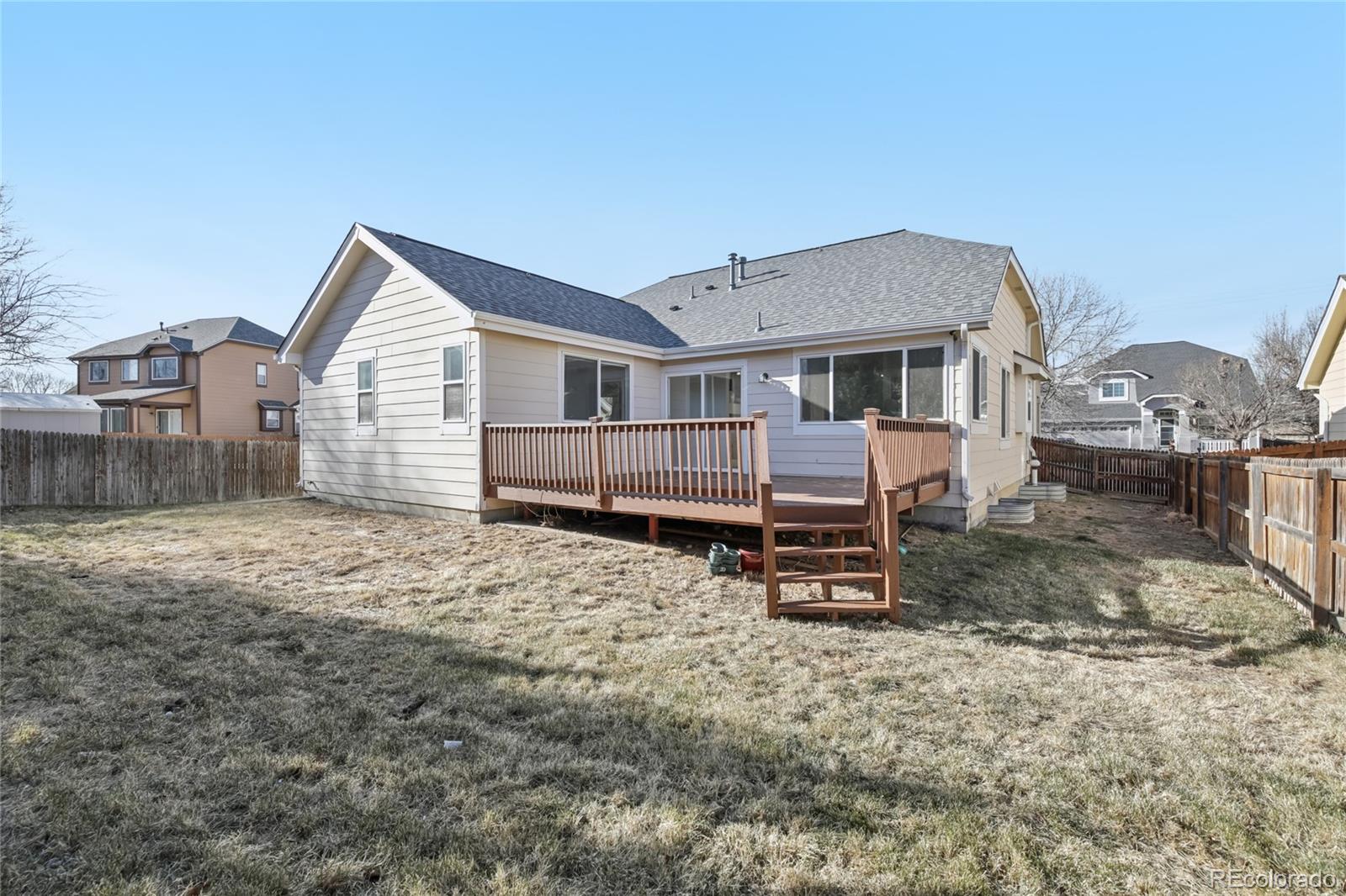 11340 Locust Street Thornton, CO 80233 - Photo 28 of 33 a view of a house with a yard