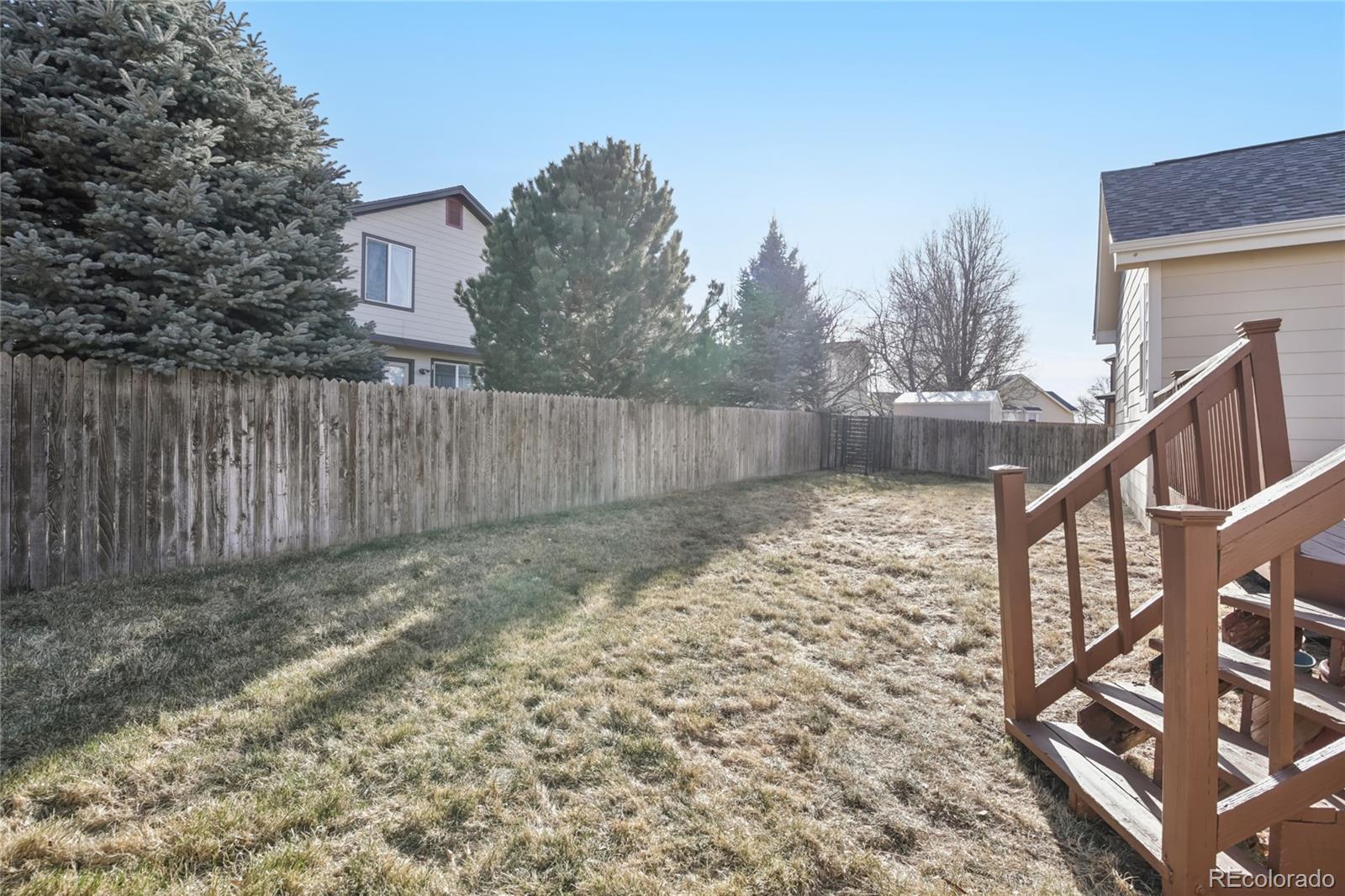 11340 Locust Street Thornton, CO 80233 - Photo 29 of 33 a view of wooden fence