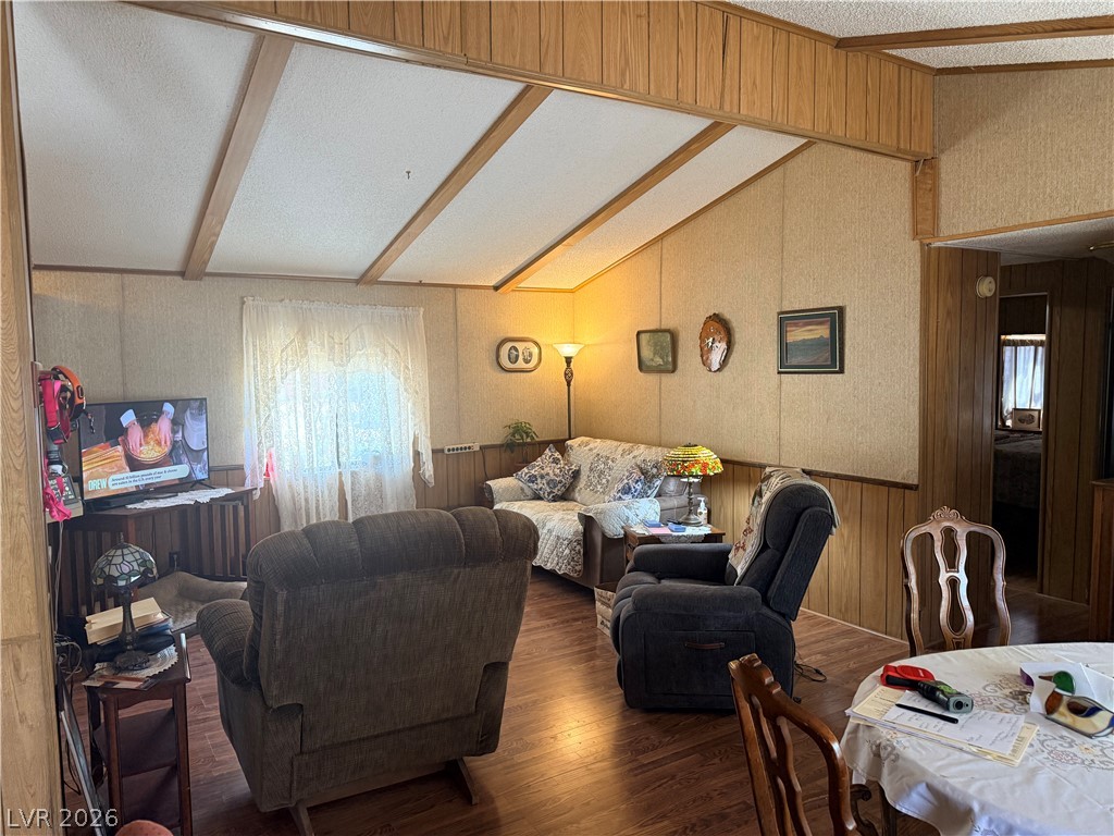 1391 West Dyer Road Pahrump, NV 89048 - Photo 40 of 50 Step into a cozy living space featuring sloped ceilings and durable flooring.