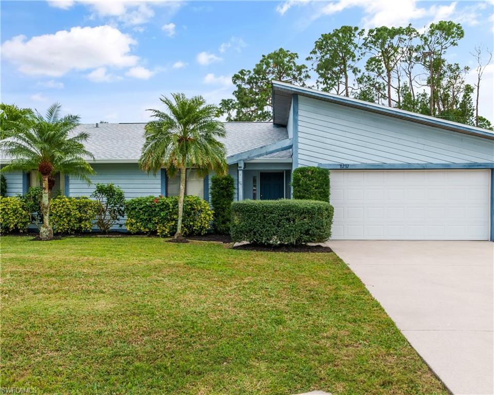 8232 Albatross Road Fort Myers, FL 33967 - Photo 2 of 27 a front view of house with yard and green space