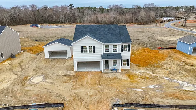 a aerial view of a house with a yard