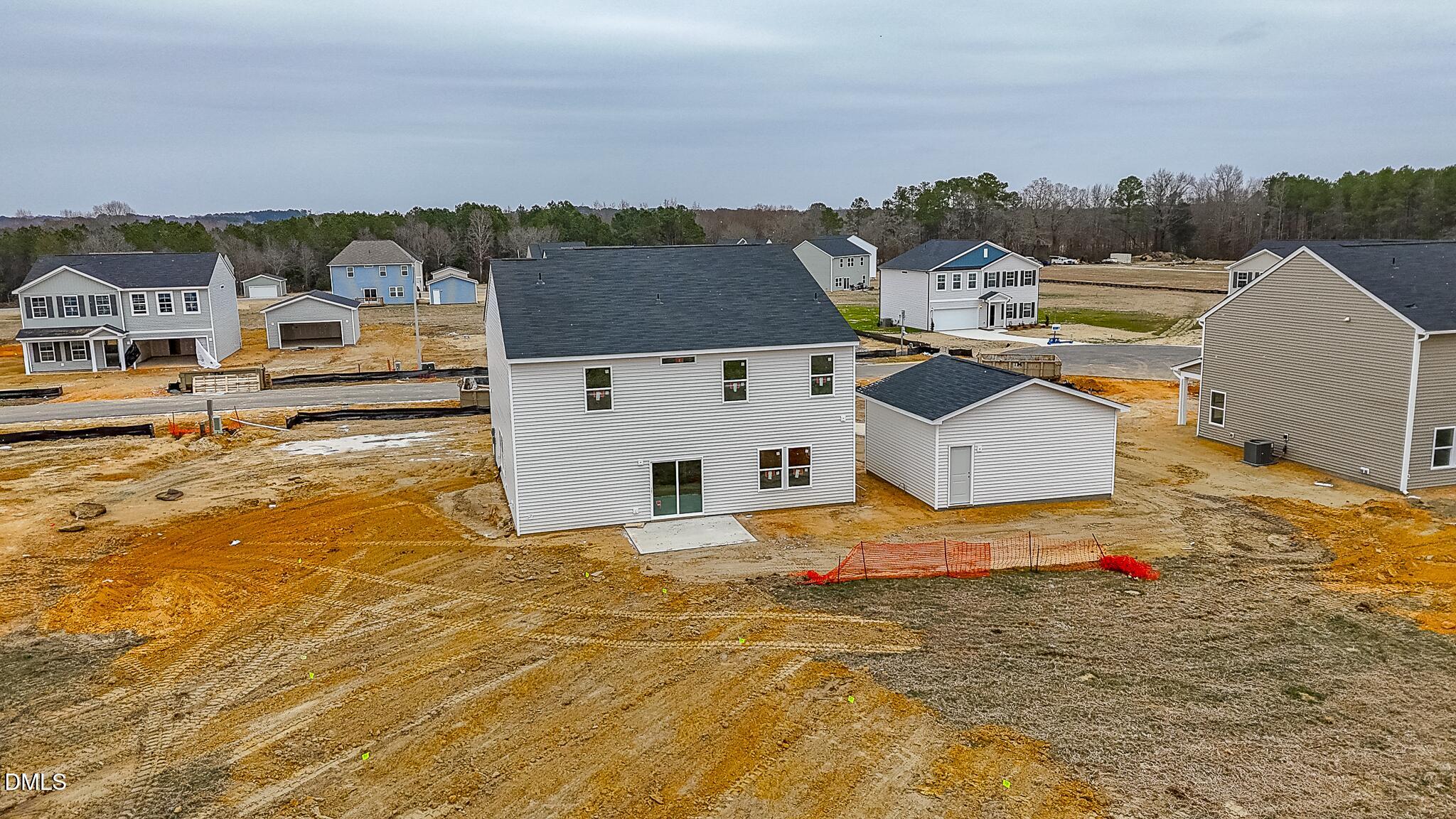 52 Osgood Street Angier, NC 27501 - Photo 7 of 8 an aerial view of residential houses with outdoor space