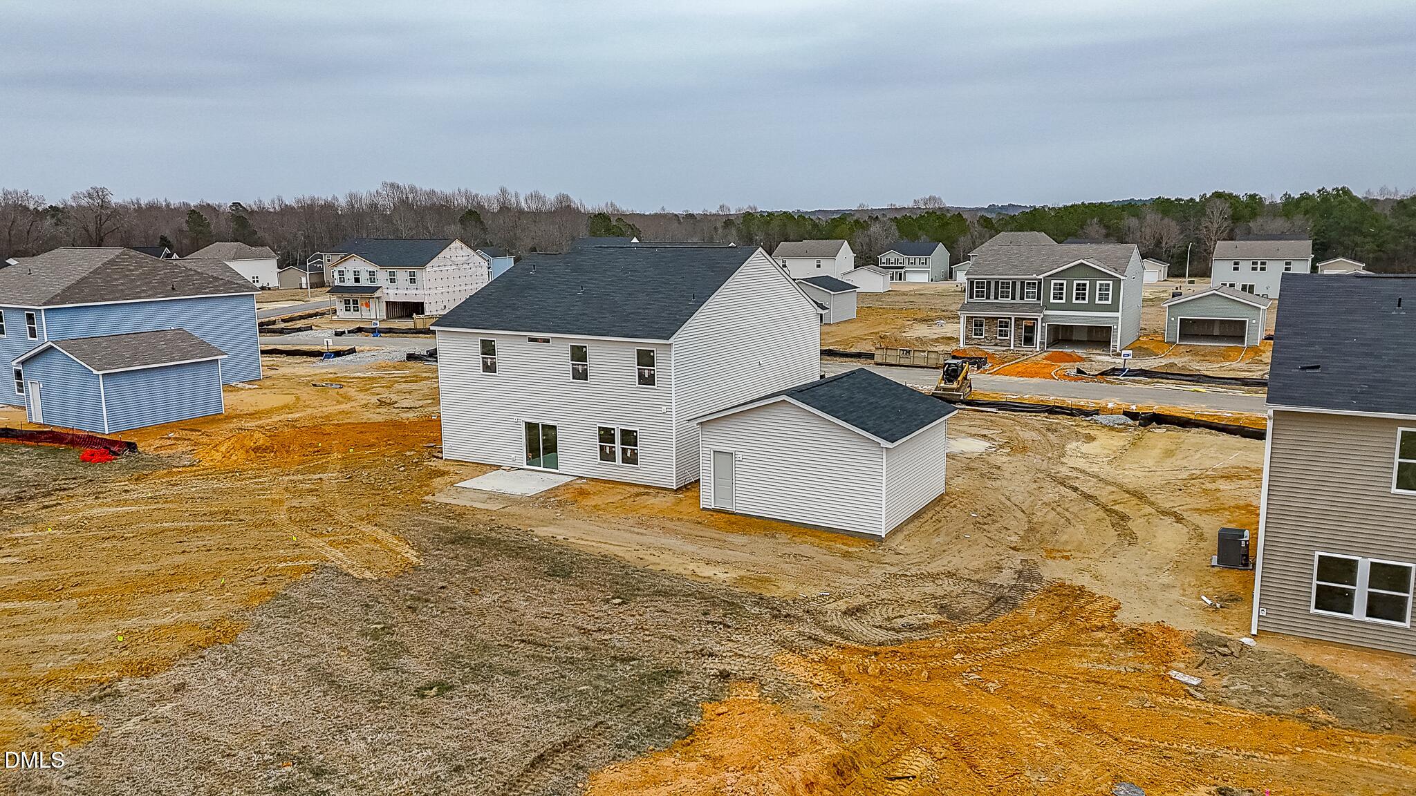 52 Osgood Street Angier, NC 27501 - Photo 8 of 8 an aerial view of residential houses with outdoor space