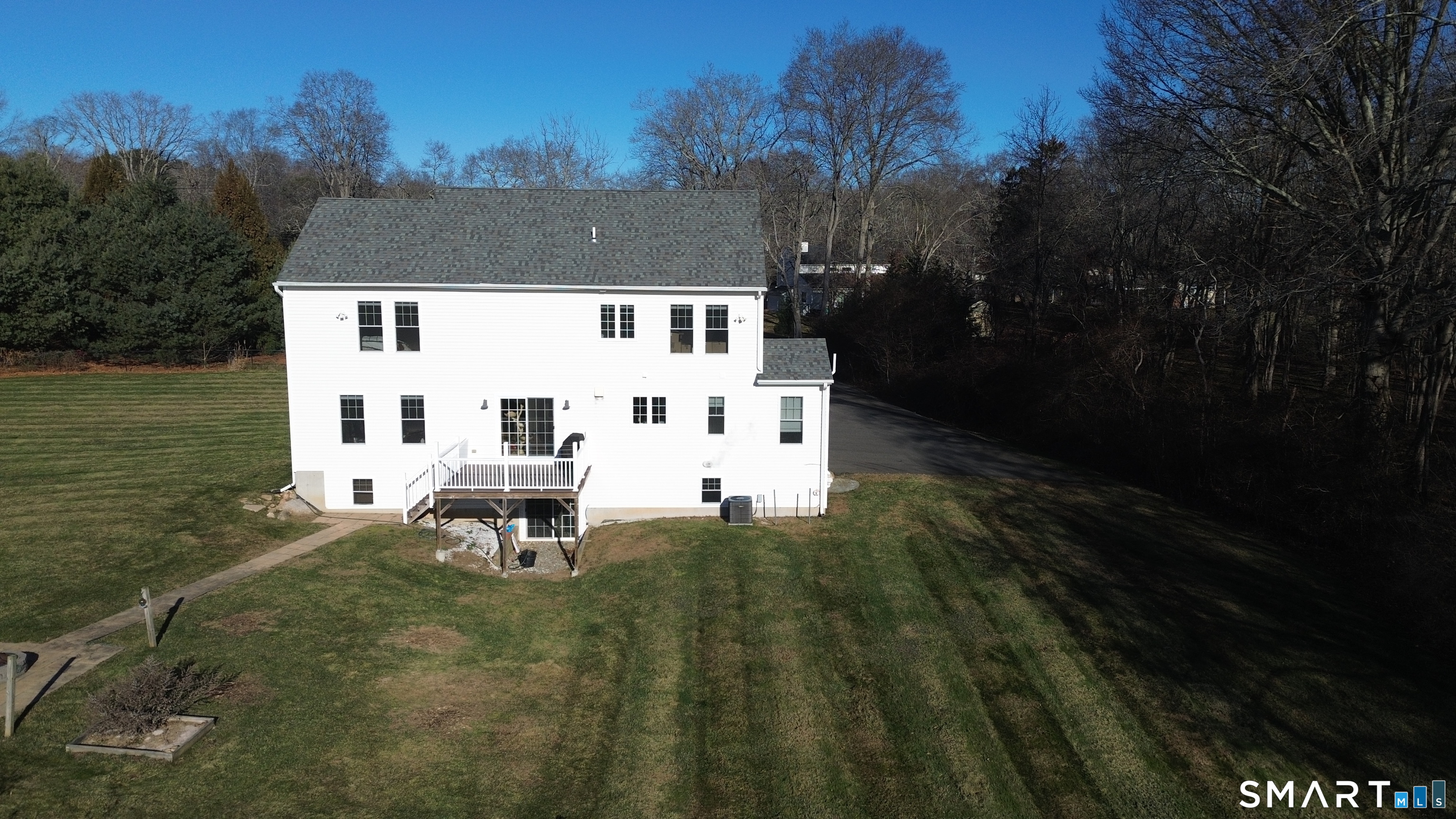 198 Green Hill Road Madison, CT 06443 - Photo 11 of 26 a white house with a yard in front of it