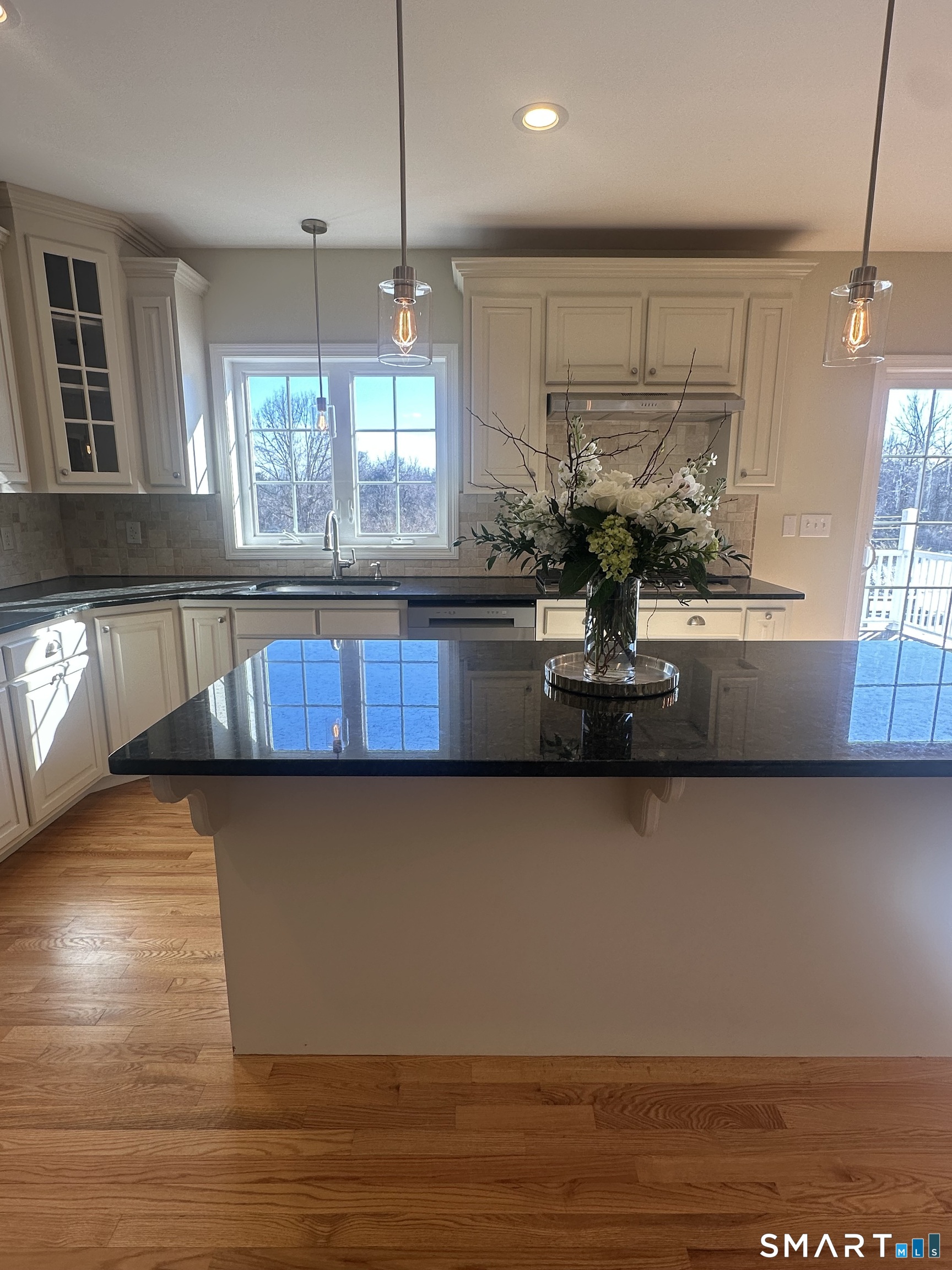 198 Green Hill Road Madison, CT 06443 - Photo 14 of 26 a kitchen with stainless steel appliances granite countertop a stove a sink and a microwave