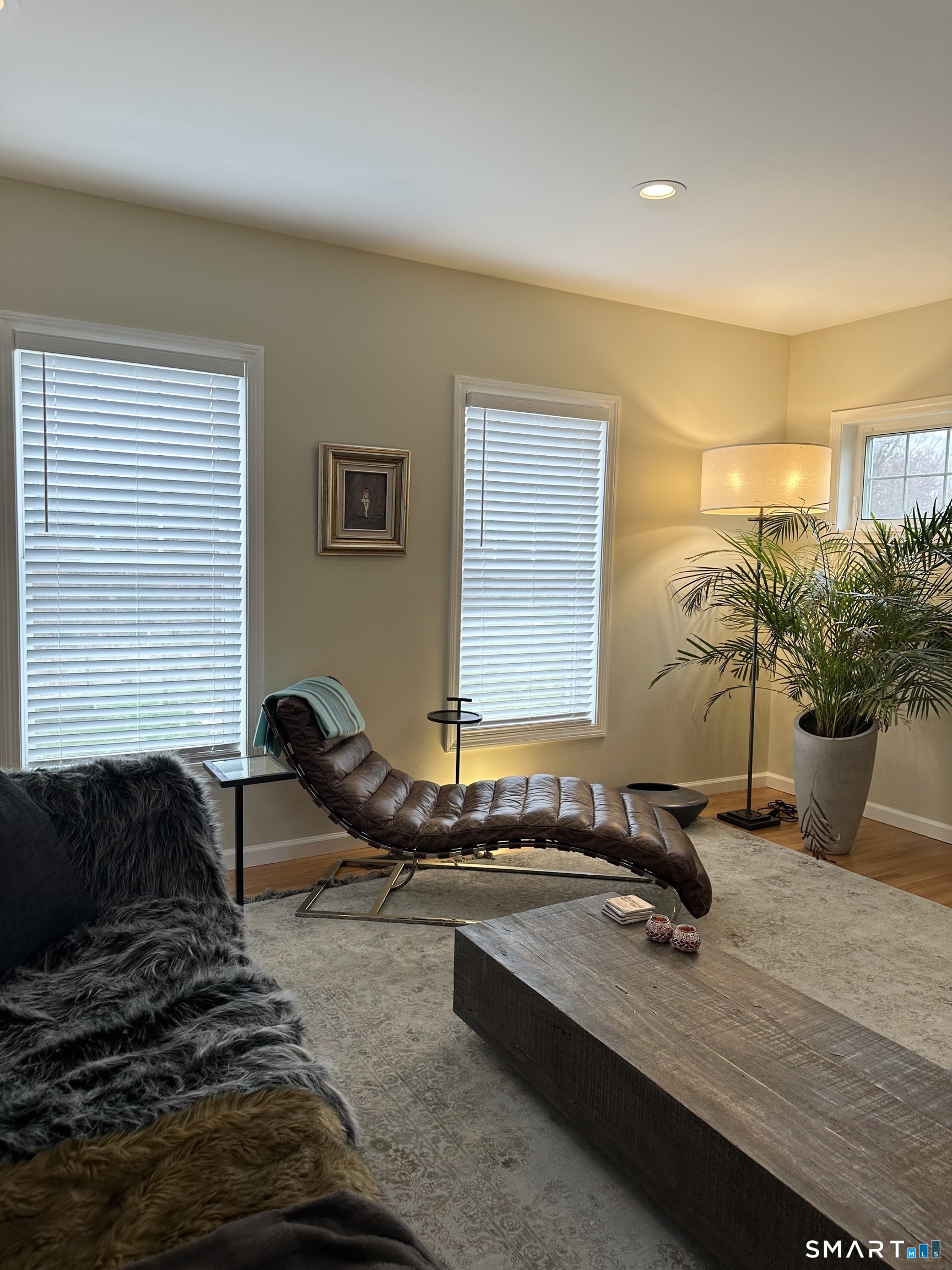 198 Green Hill Road Madison, CT 06443 - Photo 16 of 26 a living room with furniture gym equipment and potted plant