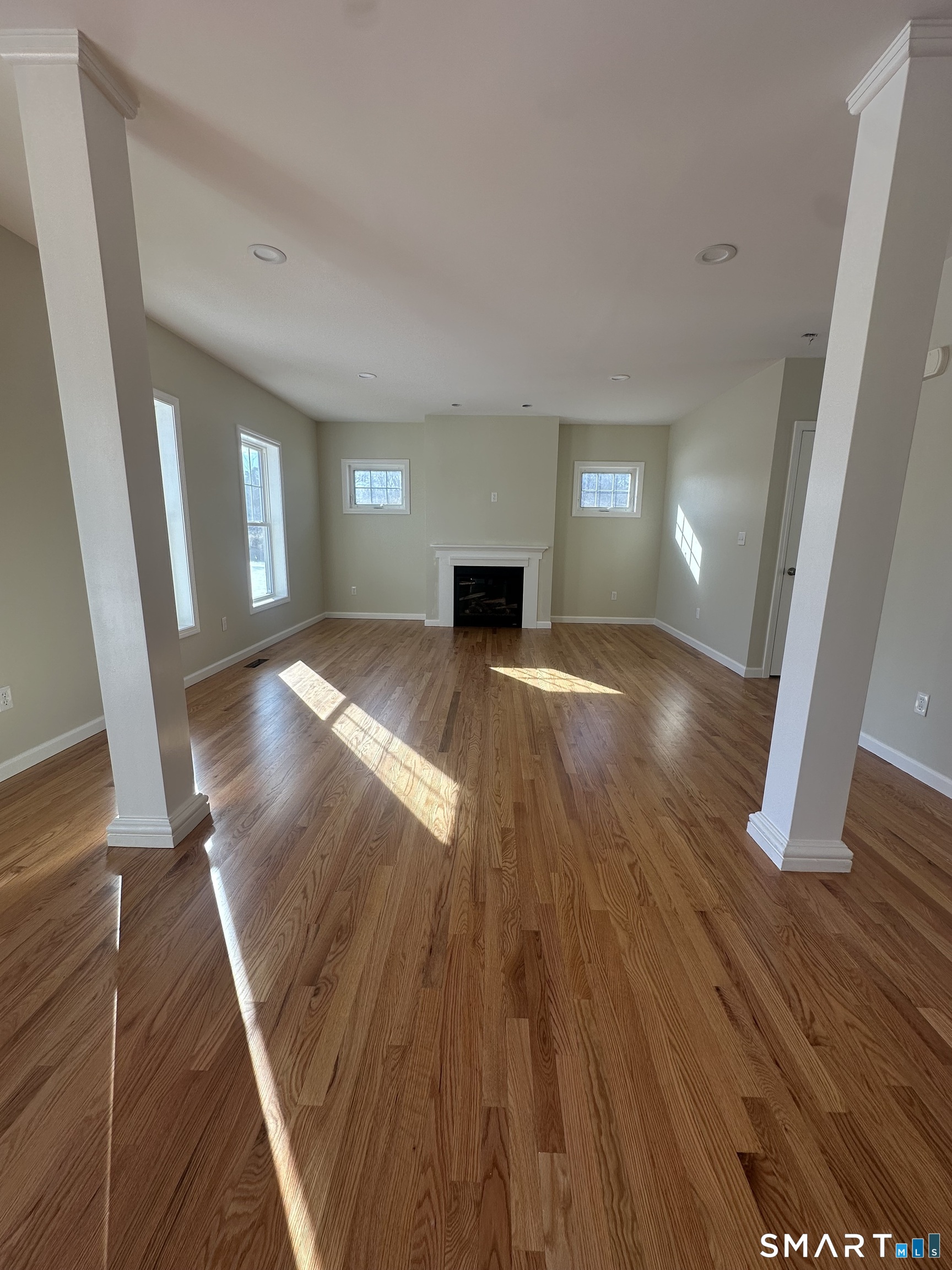 198 Green Hill Road Madison, CT 06443 - Photo 17 of 26 a view of a livingroom with wooden floor and staircase