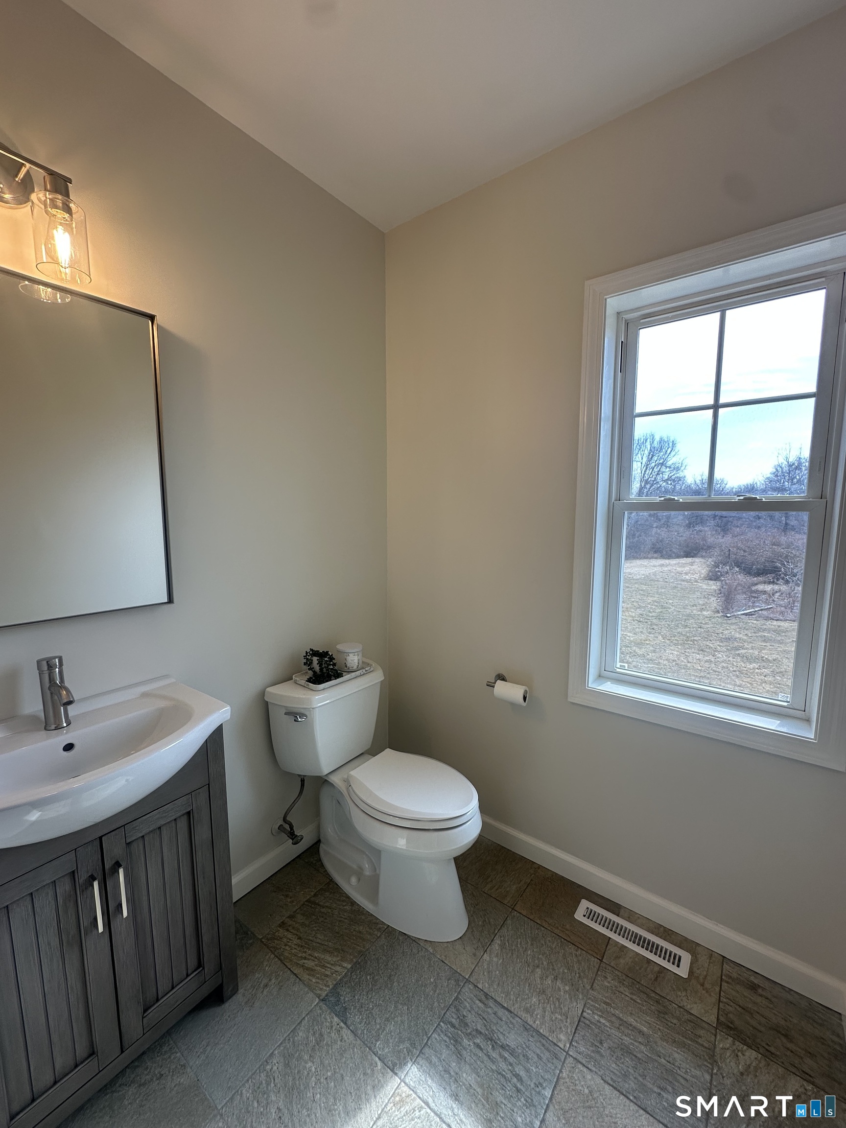 198 Green Hill Road Madison, CT 06443 - Photo 21 of 26 a bathroom with a toilet sink and a window