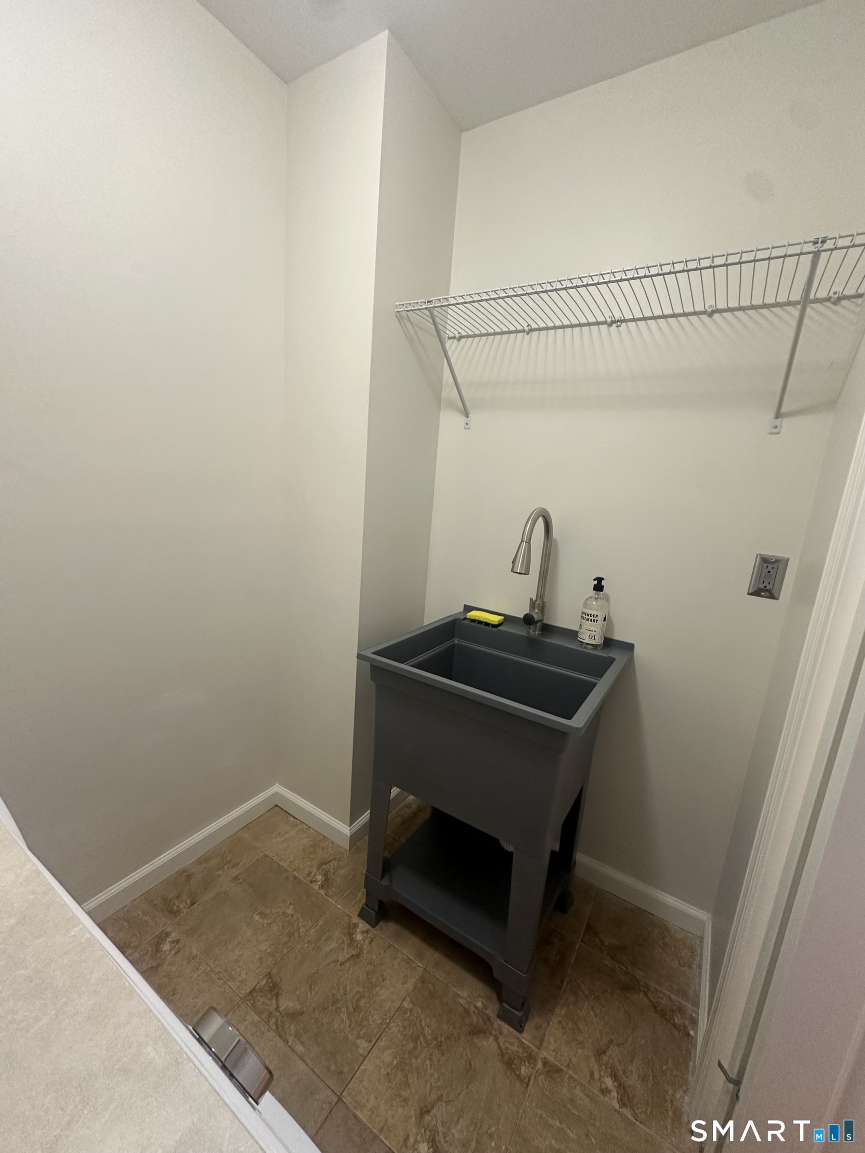 198 Green Hill Road Madison, CT 06443 - Photo 4 of 26 a room with a sink and cabinets