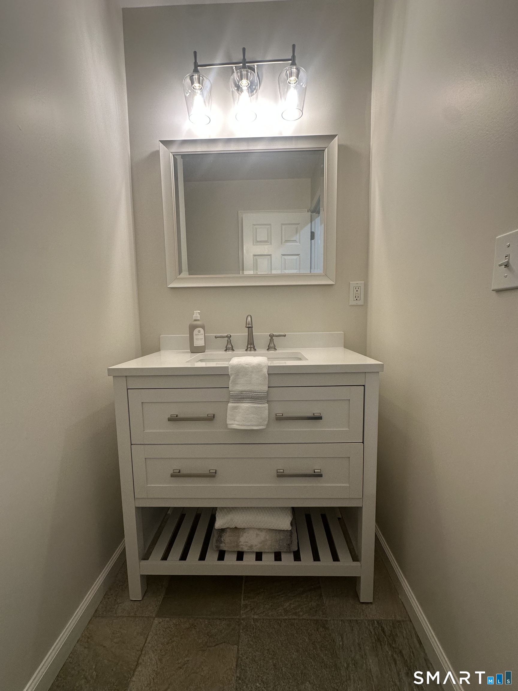 198 Green Hill Road Madison, CT 06443 - Photo 6 of 26 a bathroom with a sink and a mirror