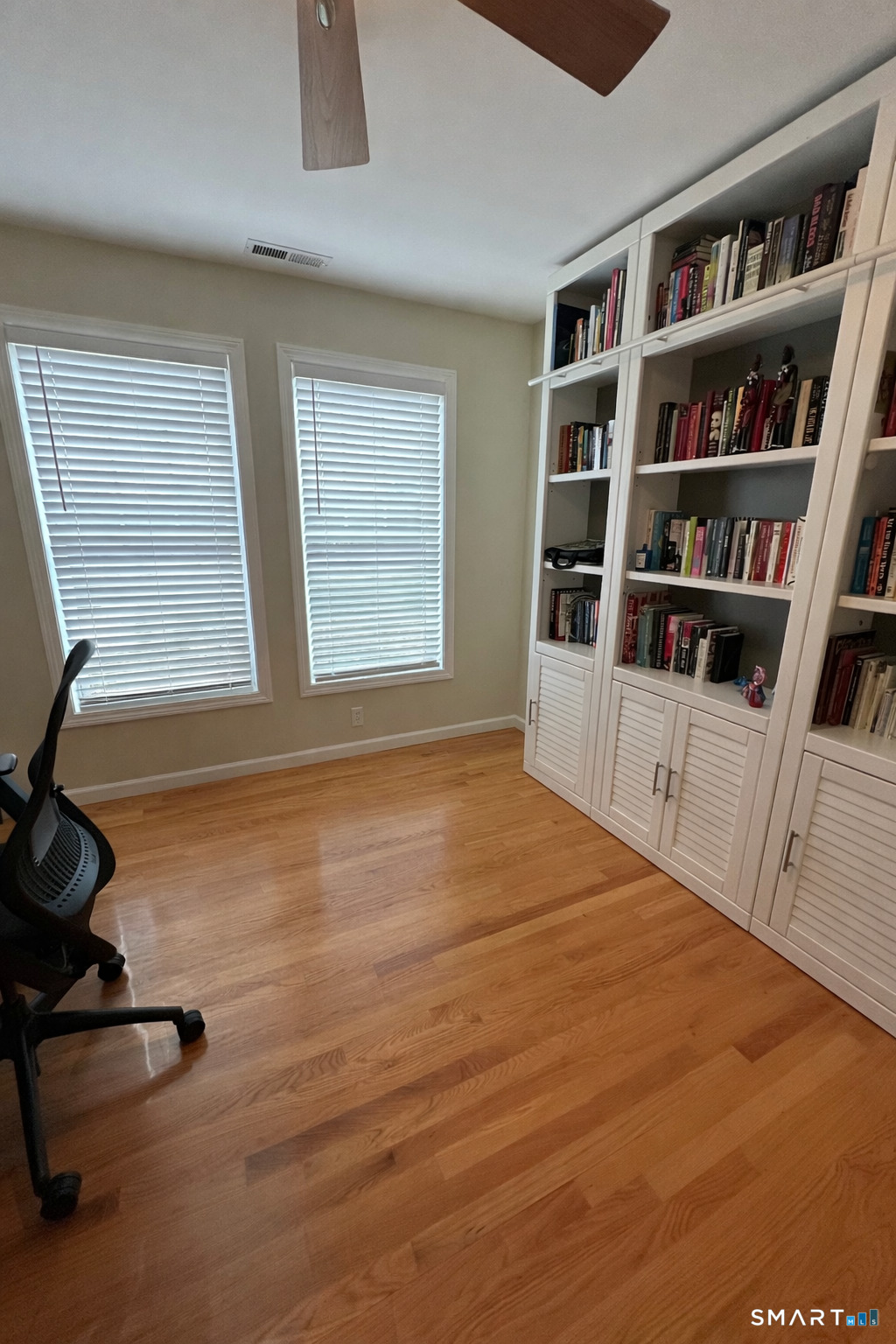 198 Green Hill Road Madison, CT 06443 - Photo 8 of 26 a room with window and book shelf