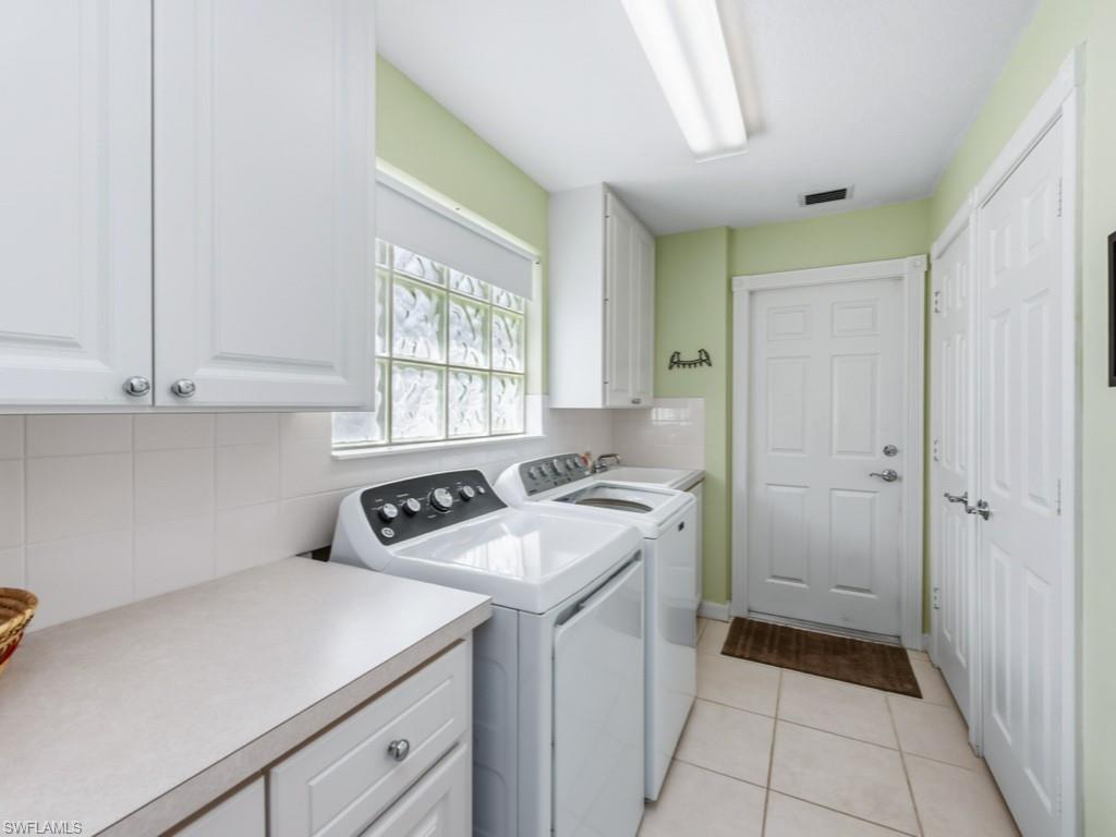 7520 Firenze Lane Naples, FL 34114 - Photo 18 of 32 a utility room with sink dryer and washer