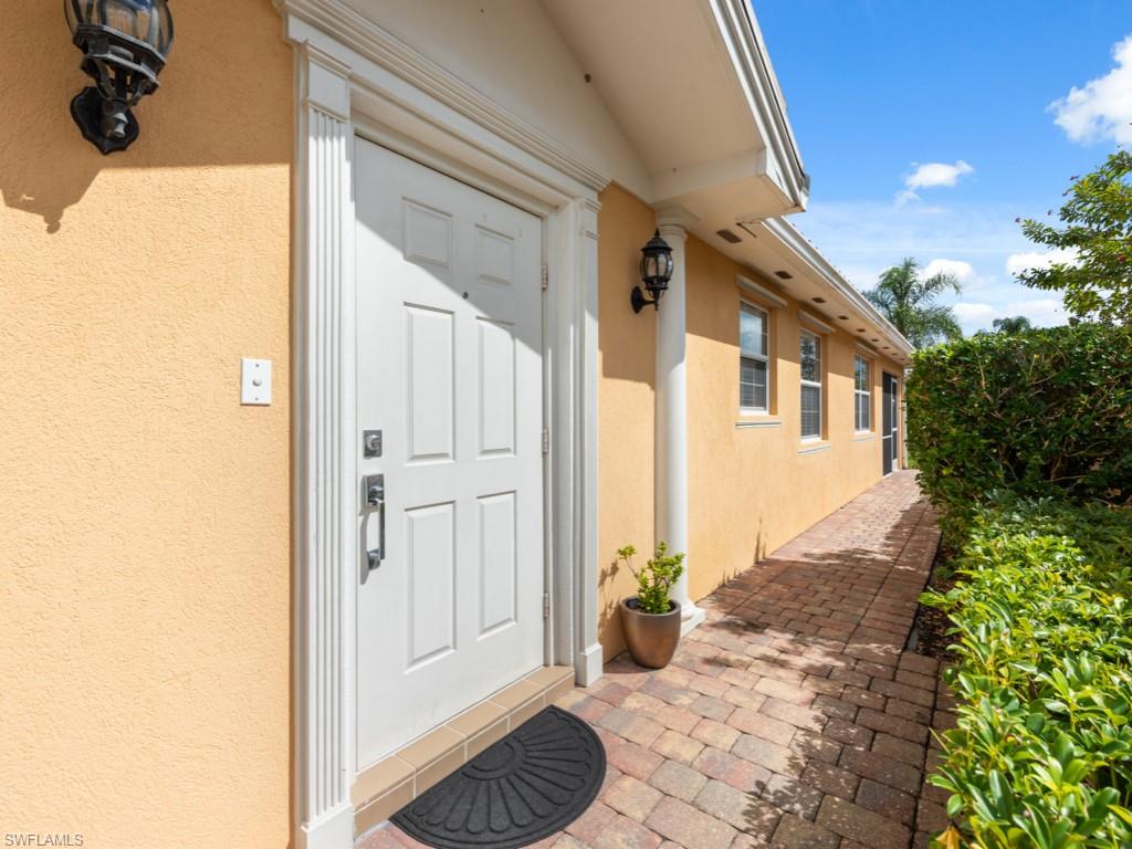 7520 Firenze Lane Naples, FL 34114 - Photo 2 of 32 a view of a entryway door of the house