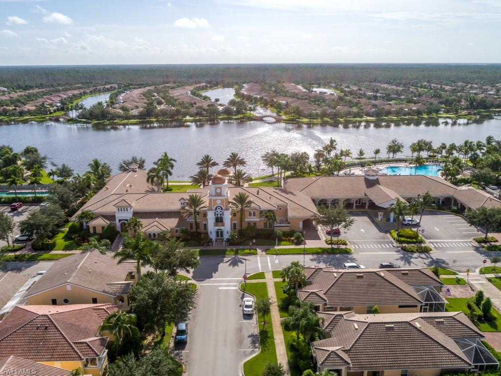 7520 Firenze Lane Naples, FL 34114 - Photo 23 of 32 an aerial view of lake and residential houses with outdoor space