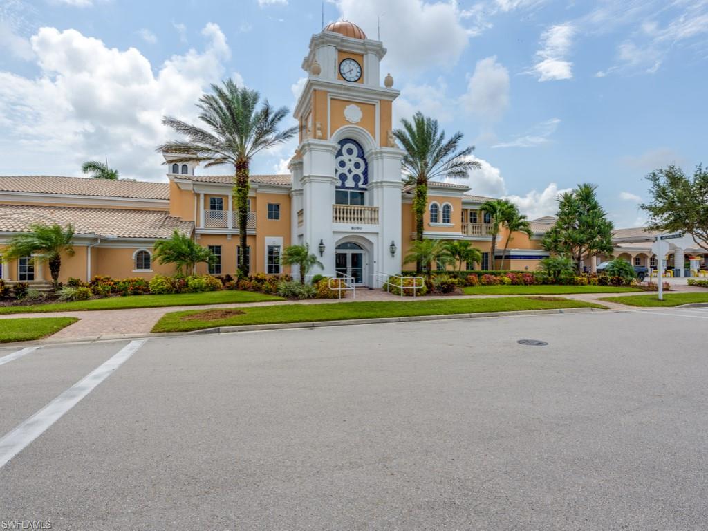 7520 Firenze Lane Naples, FL 34114 - Photo 24 of 32 a front view of building with yard and green space