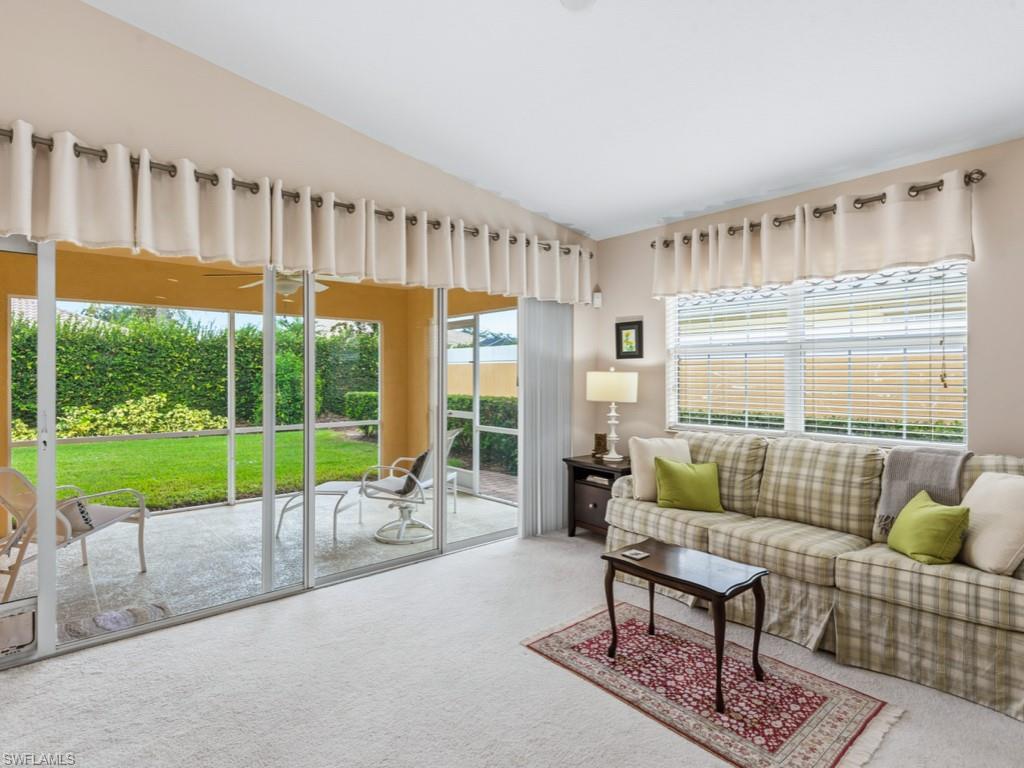 7520 Firenze Lane Naples, FL 34114 - Photo 4 of 32 a living room with furniture and a large window