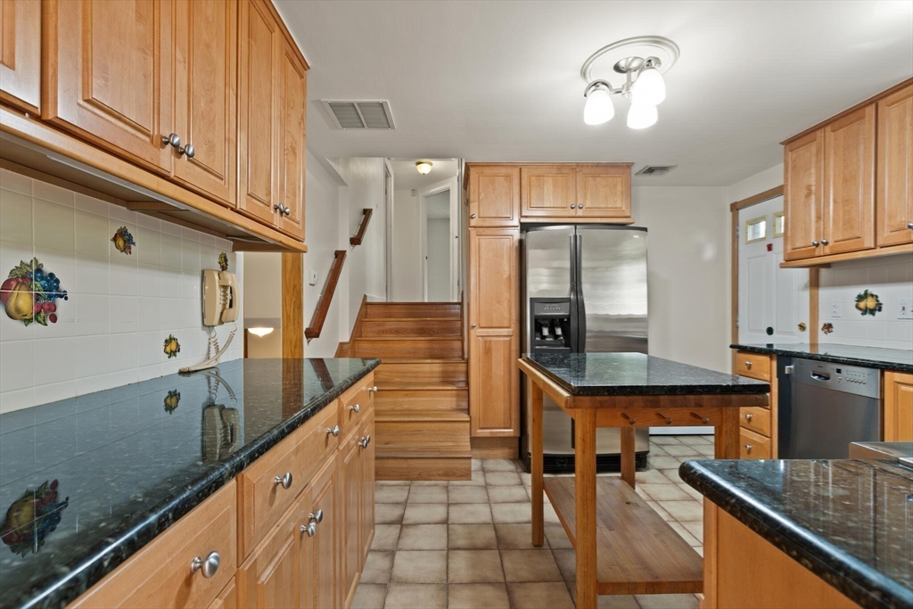 34 Ridgewood Road Westwood, MA 02090 - Photo 11 of 31 a kitchen with granite countertop a sink and cabinets