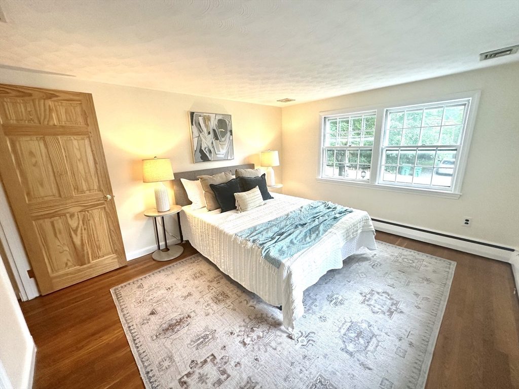 34 Ridgewood Road Westwood, MA 02090 - Photo 14 of 31 a bed sitting in a bedroom next to a window