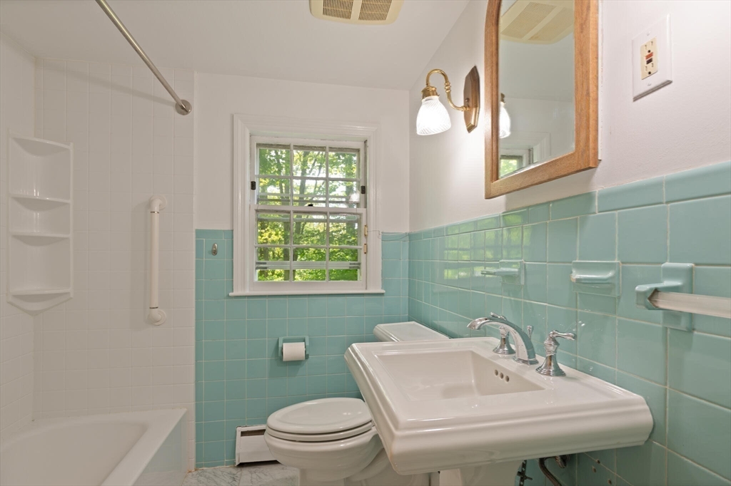 34 Ridgewood Road Westwood, MA 02090 - Photo 19 of 31 a bathroom with a sink a toilet and mirror