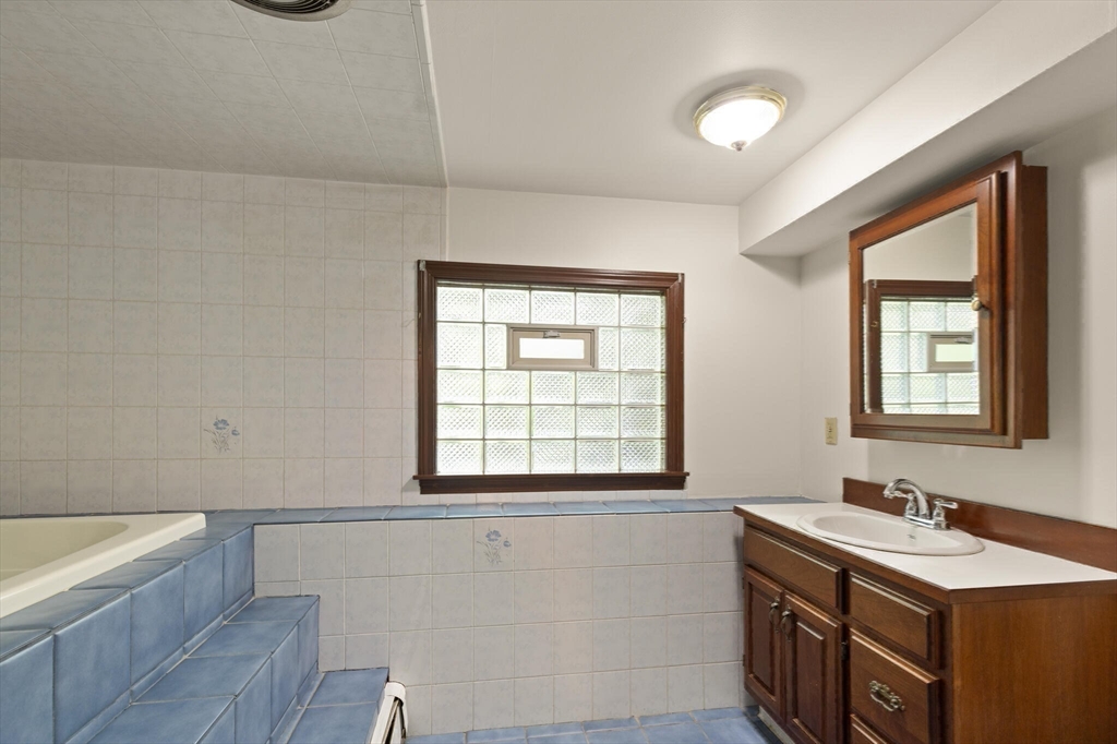 34 Ridgewood Road Westwood, MA 02090 - Photo 20 of 31 a bathroom with a sink and a bathtub