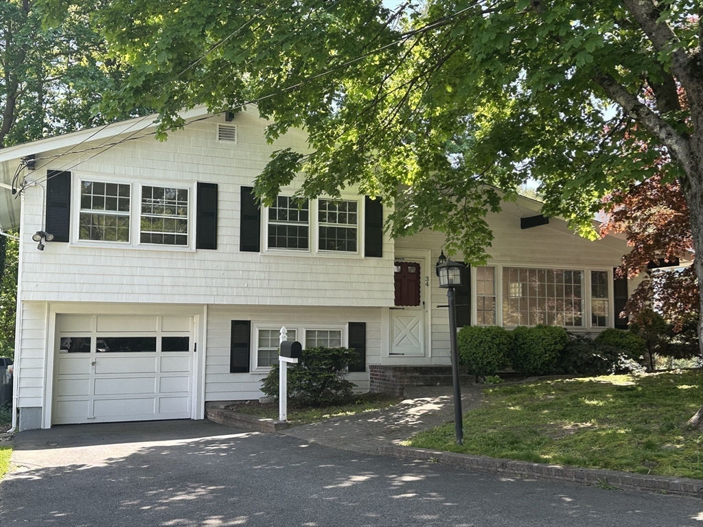 34 Ridgewood Road Westwood, MA 02090 - Photo 2 of 31 a front view of a house with garden