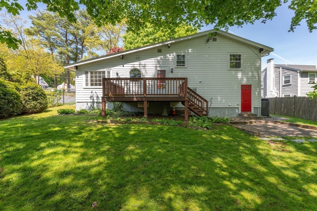 34 Ridgewood Road Westwood, MA 02090 - Photo 27 of 31 a backyard of a house with table and chairs