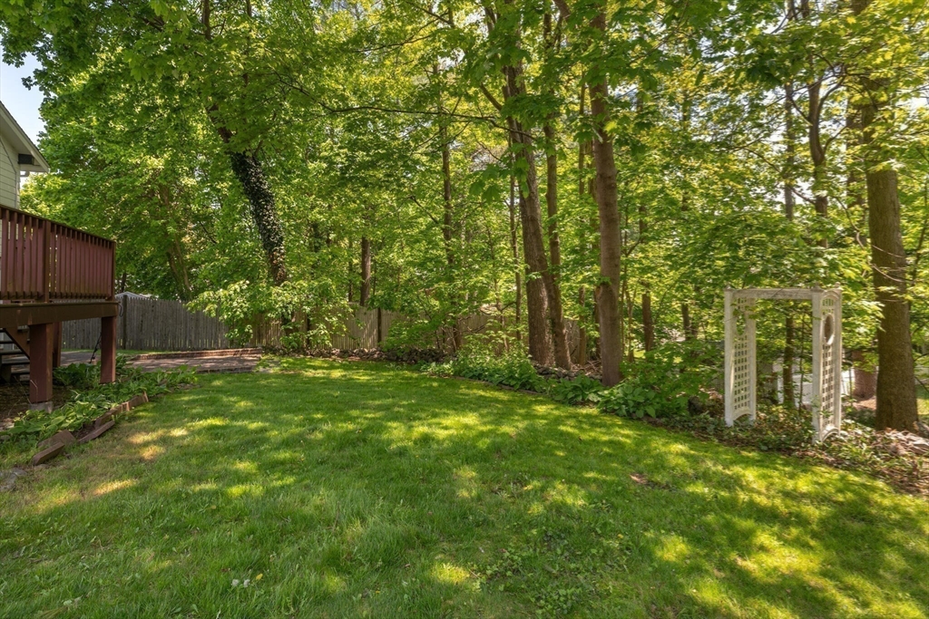 34 Ridgewood Road Westwood, MA 02090 - Photo 29 of 31 a backyard of a house with plants and large trees