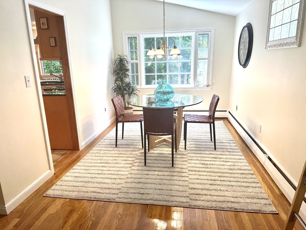 34 Ridgewood Road Westwood, MA 02090 - Photo 6 of 31 a dining room with furniture a rug and wooden floor