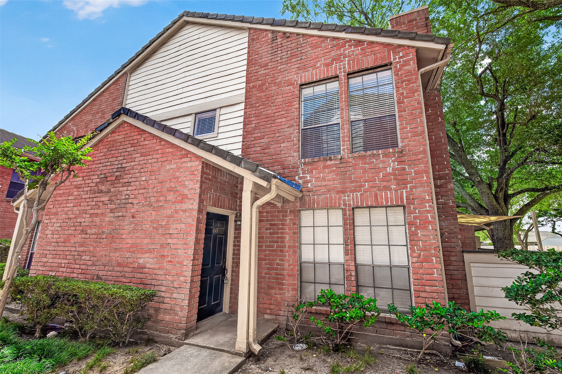 2211 South Kirkwood Road, Unit 68 Houston, TX 77077 - Photo 2 of 14 Charming two-story townhome featuring classic brick exterior and a private, enclosed patio for added outdoor living. This well-maintained home offers a functional layout with spacious living and dining areas, updated finishes, and abundant natural light throughout. The kitchen includes granite countertops, ample cabinetry, and a practical design perfect for everyday living. Upstairs, you’ll find comfortable bedrooms with generous closet space. Enjoy low-maintenance living with a cozy courtyard-style patio