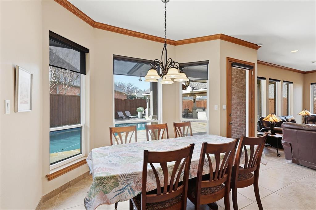 3413 Lantz Circle Plano, TX 75025 - Photo 15 of 38 a dining room with furniture a chandelier and window