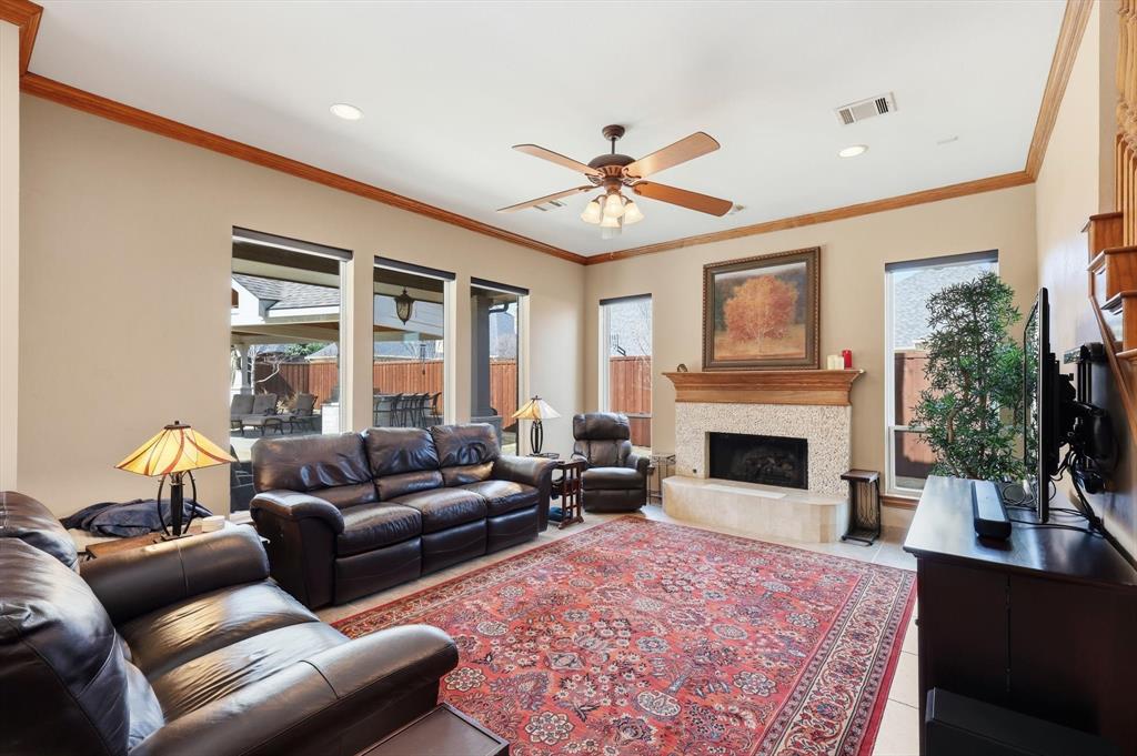 3413 Lantz Circle Plano, TX 75025 - Photo 16 of 38 a living room with furniture and a fireplace