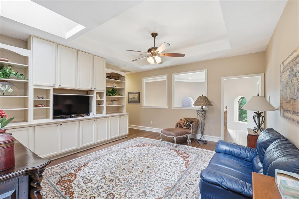 3413 Lantz Circle Plano, TX 75025 - Photo 19 of 38 a living room with furniture and a flat screen tv