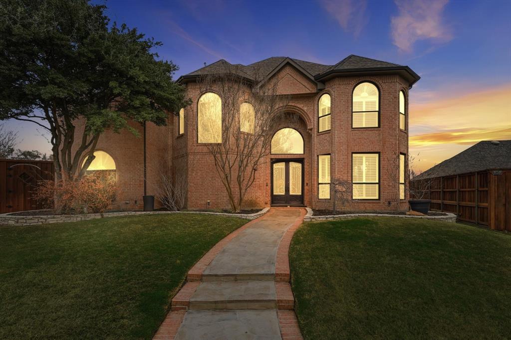 3413 Lantz Circle Plano, TX 75025 - Photo 2 of 38 a front view of a house with a garden