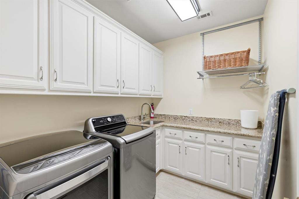3413 Lantz Circle Plano, TX 75025 - Photo 22 of 38 a kitchen with appliances cabinets and a counter top space