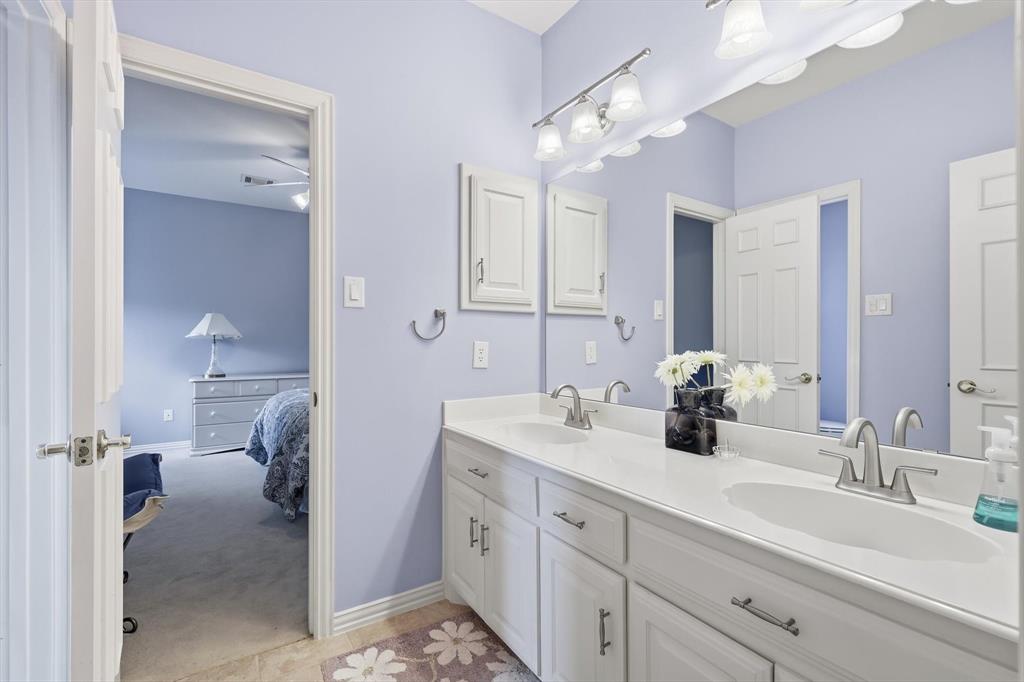 3413 Lantz Circle Plano, TX 75025 - Photo 28 of 38 a en suite bathroom with double sink and a mirror