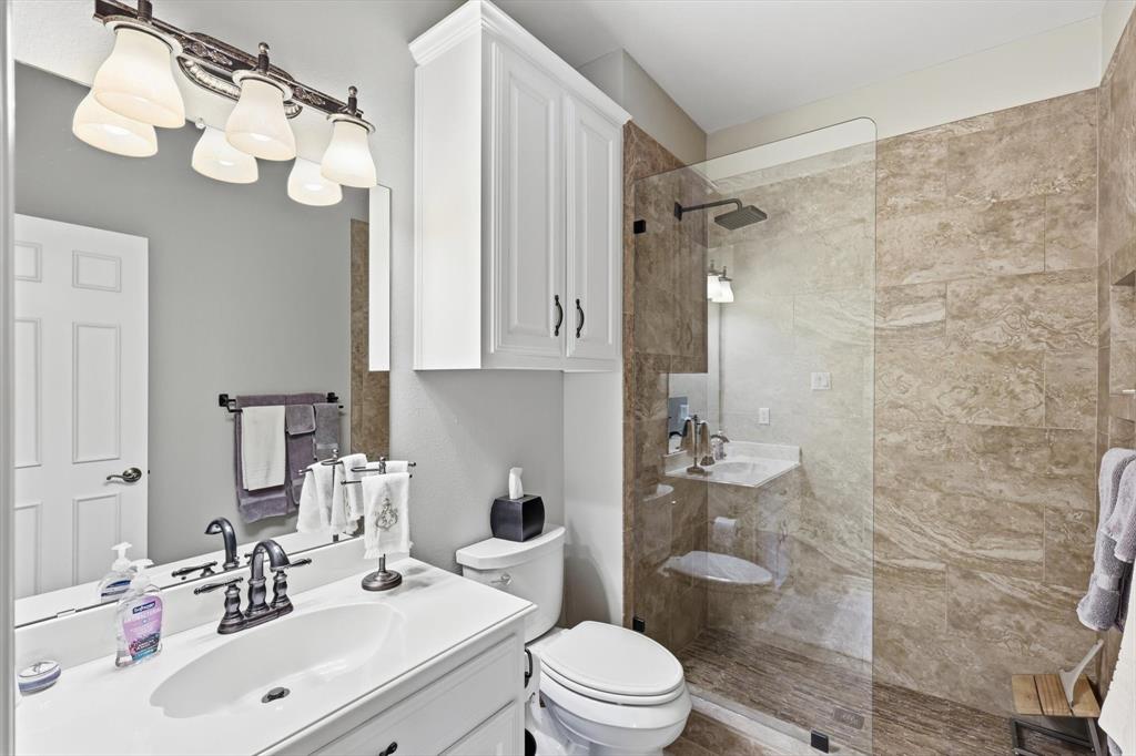 3413 Lantz Circle Plano, TX 75025 - Photo 30 of 38 a bathroom with a sink a toilet and shower