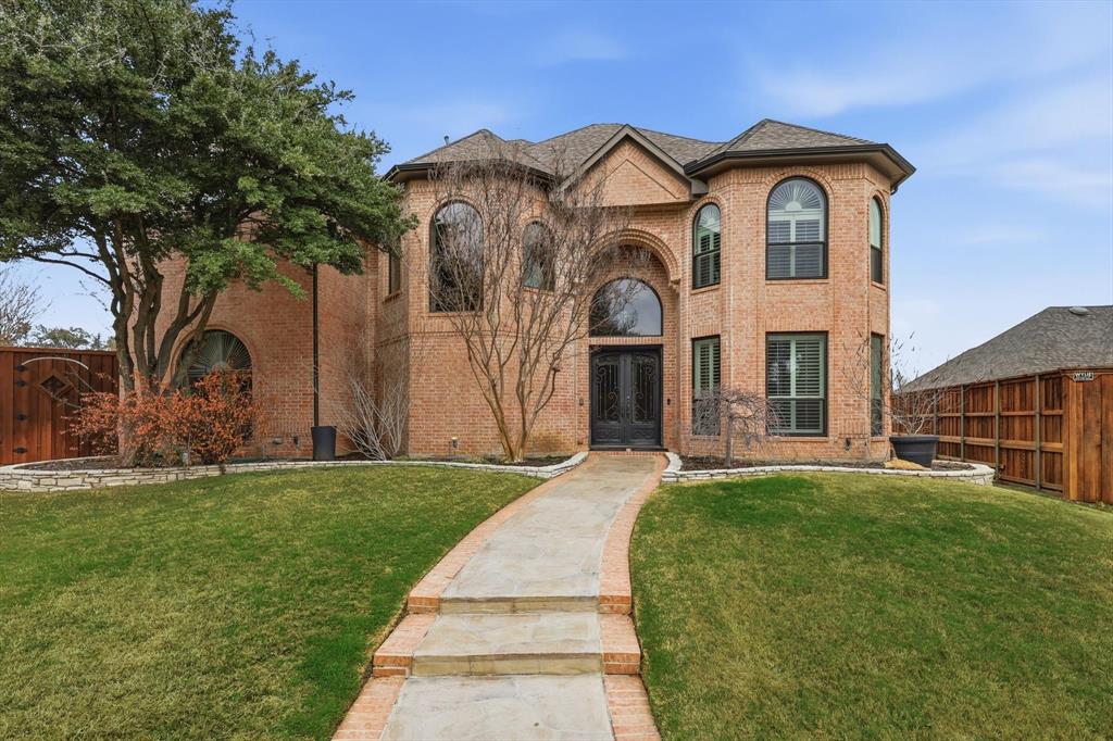 3413 Lantz Circle Plano, TX 75025 - Photo 3 of 38 a front view of a house with a garden