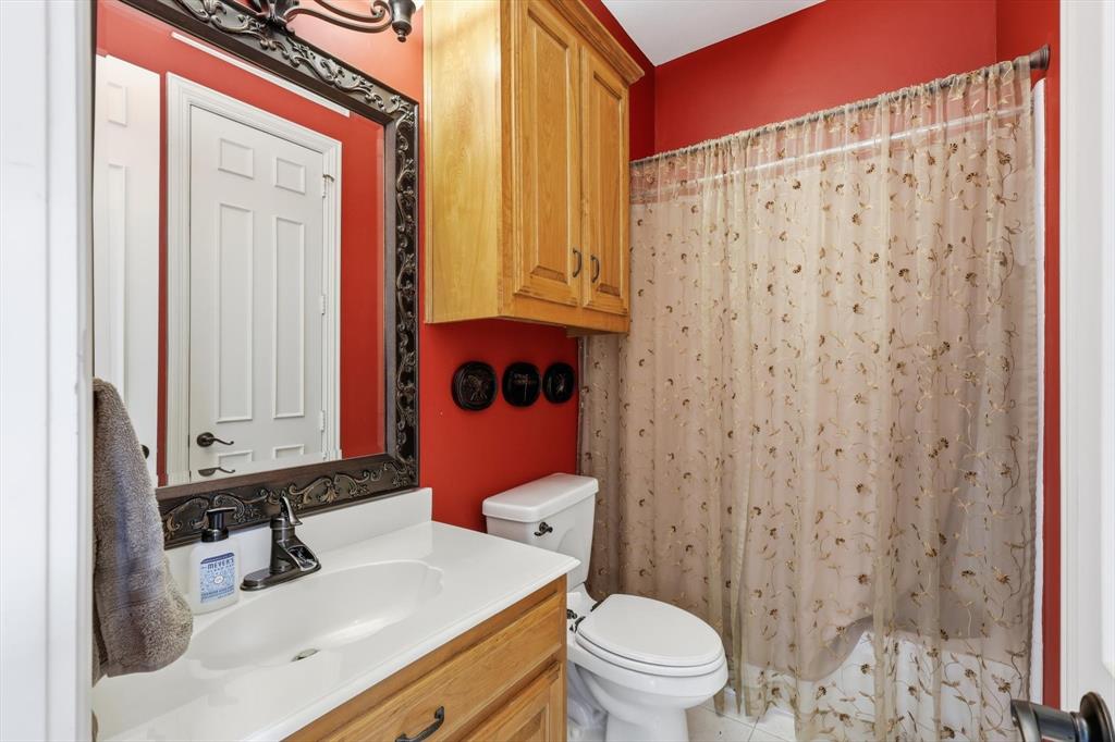 3413 Lantz Circle Plano, TX 75025 - Photo 31 of 38 a bathroom with a sink toilet and shower