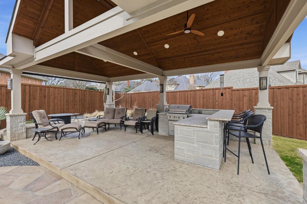 3413 Lantz Circle Plano, TX 75025 - Photo 34 of 38 a view of a patio with table and chairs with wooden floor and fence