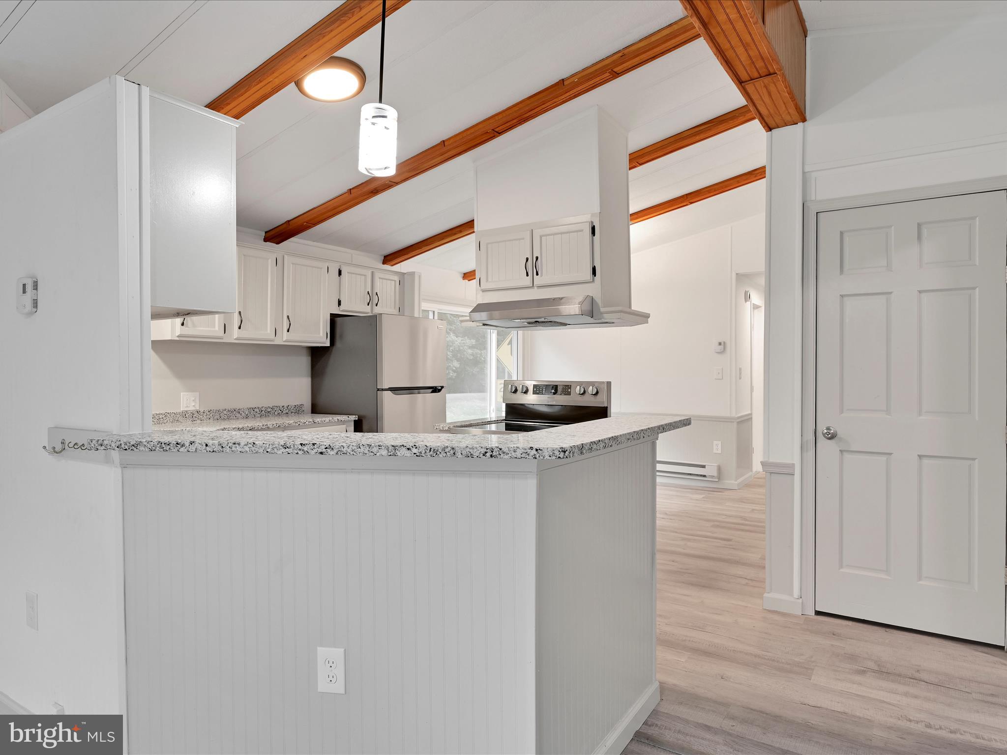 207 Mill Creek Road Kutztown, PA 19530 - Photo 5 of 26 a kitchen with stainless steel appliances granite countertop a sink and a refrigerator