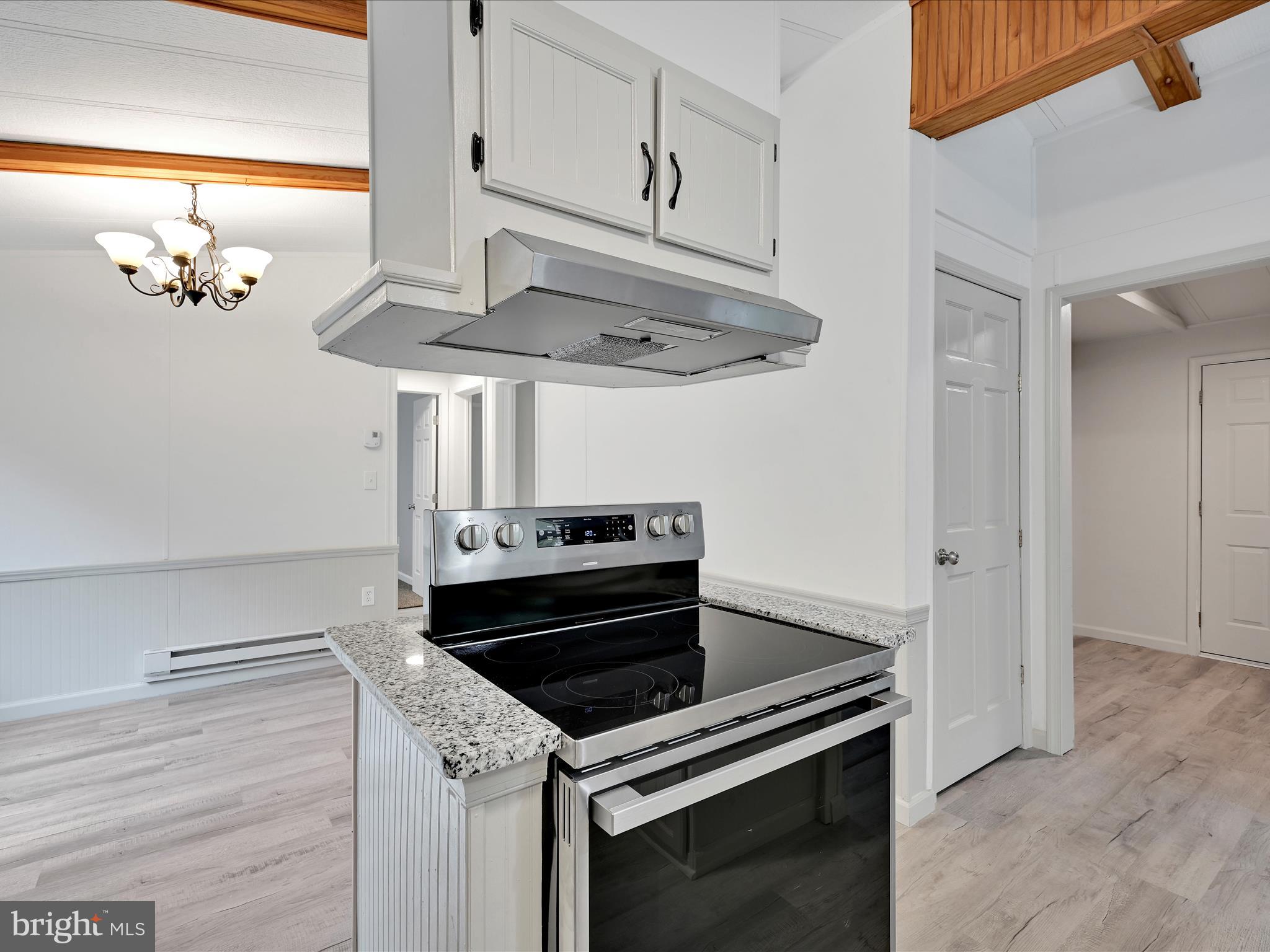 207 Mill Creek Road Kutztown, PA 19530 - Photo 8 of 26 a kitchen with a stove and a microwave