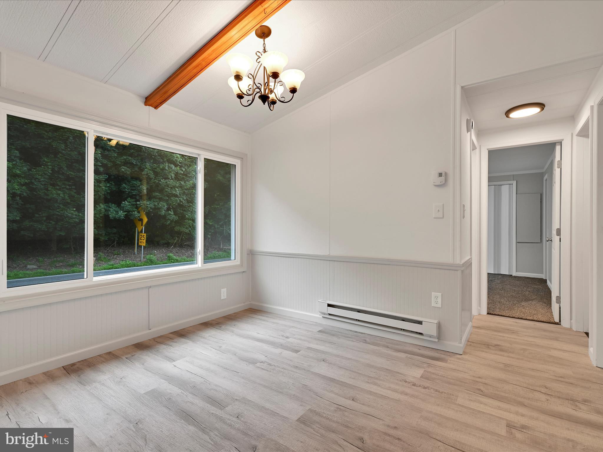 207 Mill Creek Road Kutztown, PA 19530 - Photo 9 of 26 wooden floor in an empty room with a window